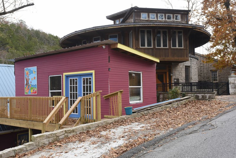 A lawsuit claims the addition to a home (left) has ruined the visual ambiance, historical value and view of the round stone house (right) in Eureka Springs. Twyla Pease of Iowa, owner of the round house, seeks to have the addition torn down or be paid $300,000 in damages.