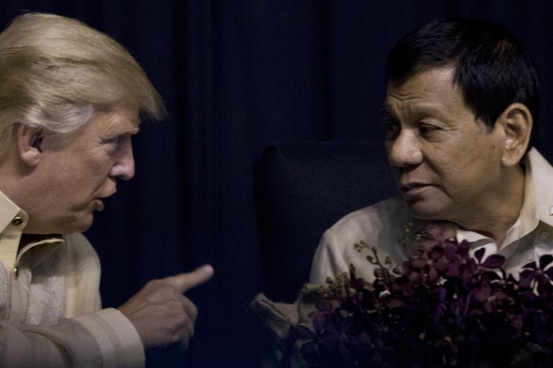 The Associated Press TRUMP: President Donald Trump speaks with Philippines President Rodrigo Duterte Sunday at an ASEAN Summit dinner at the SMX Convention Center in Manila, Philippines.