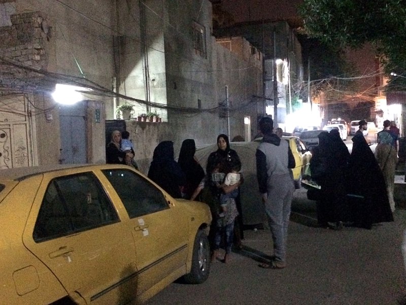 The Associated Press EARTHQUAKE: People stand in the street after feeling aftershocks from an earthquake Sunday in Baghdad, Iraq. The deadly earthquake hit the region along the border between Iran and Iraq on Sunday. The U.S. Geological Survey said the quake was centered 19 miles (31 kilometers) outside the eastern Iraqi city of Halabja.