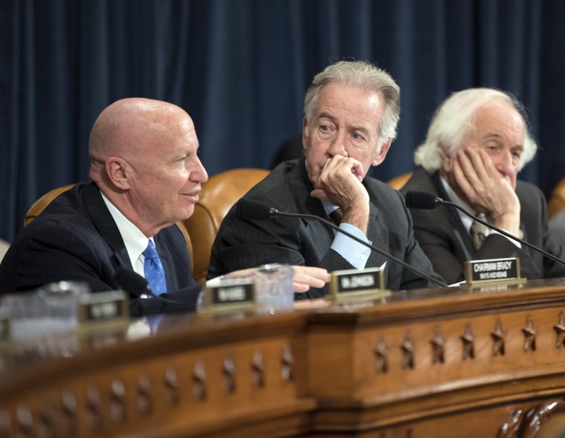 The Associated Press TAXES: House Ways and Means Committee Chairman Kevin Brady, R-Texas, left, joined by Rep. Richard Neal, D-Mass., the ranking member, and Rep. Sander Levin, D-Mich., offers his manager's amendment as the GOP tax bill debate enters the final stage Thursday on Capitol Hill in Washington.