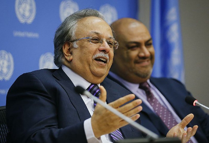 Abdallah Al-Mouallimi (left), a Saudi Arabian ambassador, and Yemeni envoy Khaled Hussein Al-Yamani speak Monday at U.N. headquarters.