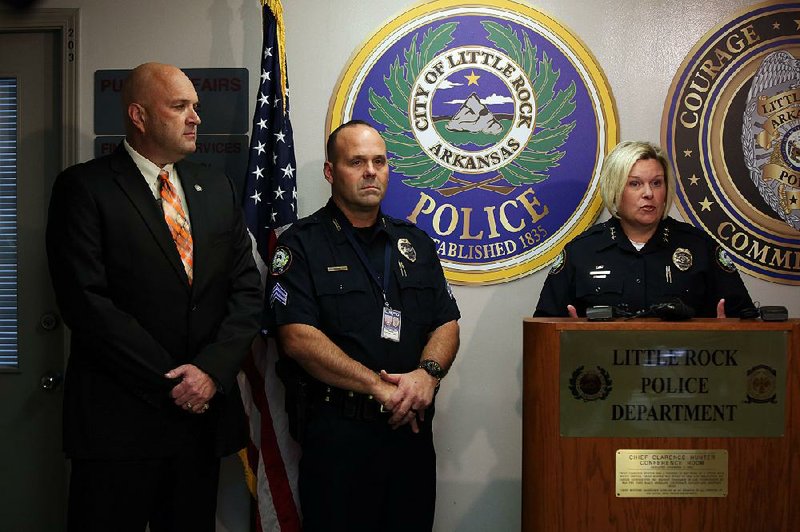 Assistant Chief Alice Fulk (right) speaks to the media Monday at Little Rock’s main police station downtown to announce that Little Rock police have acquired 160 Narcan kits for officers to use in opioid overdoses. Next to Fulk are state Drug Director Kirk Lane (left) and officer Robert Mourot.