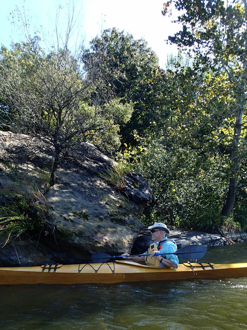 Warren Cunningham explores the rocky shores of Lincoln Lake on Oct. 13 in a kayak he built himself.