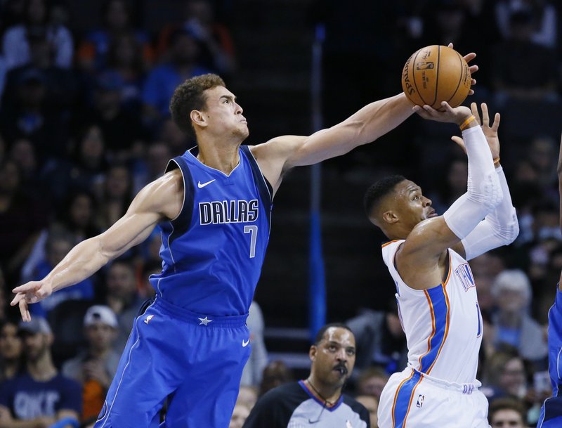 The Associated Press DENIED: Dallas Mavericks forward Dwight Powell (7) blocks a shot by Oklahoma City Thunder guard Russell Westbrook, right, in the second quarter of Sunday's game in Oklahoma City.