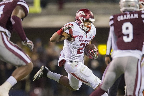 Arkansas running back Devwah Whaley carries the ball during a game against Mississippi State on Saturday, Nov. 19, 2016, in Starkville, Miss.