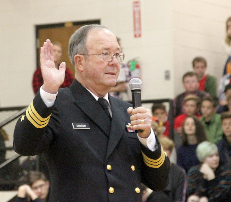 LYNN KUTTER ENTERPRISE-LEADER Commander Richard "Sam" Sansom, U.S. Navy retired, speaks about how taking the oath of office to defend the United States affected his outlook on freedom. Sansom was one of three guest speakers for the Veterans Assembly at Prairie Grove Middle School.