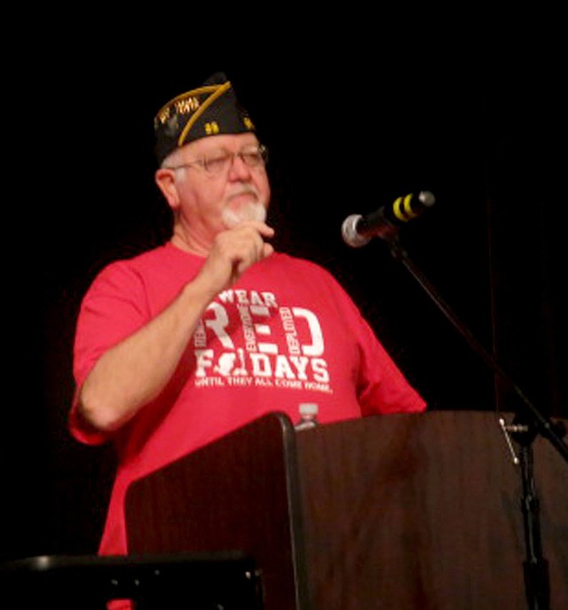 Photo by Susan Holland Al Blair was guest speaker at the Gravette High School Veterans Day assembly Nov. 10 at the GHS performing arts center. Blair, a member of the John E. Tracy American Legion Post 25 at Gravette, told about his experiences as a radioman in the United States Navy and encouraged GHS students to consider joining the military as a career.