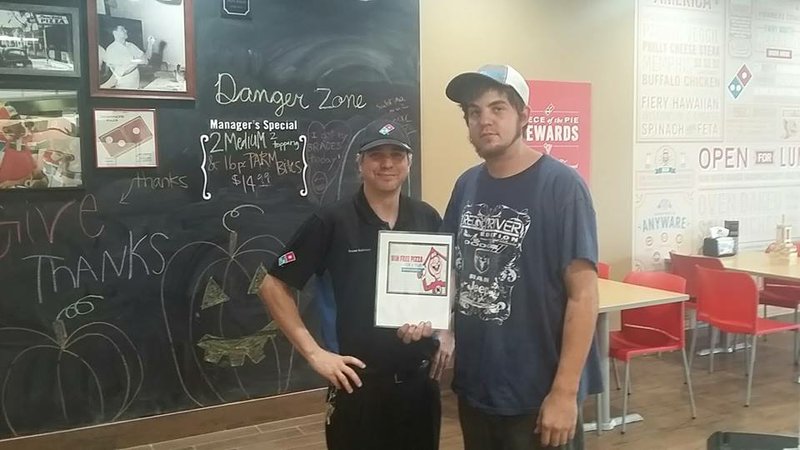 Brent Andrews, right, is pictured with Reece Robinson, the manager of Domino's in Heber Springs. 
