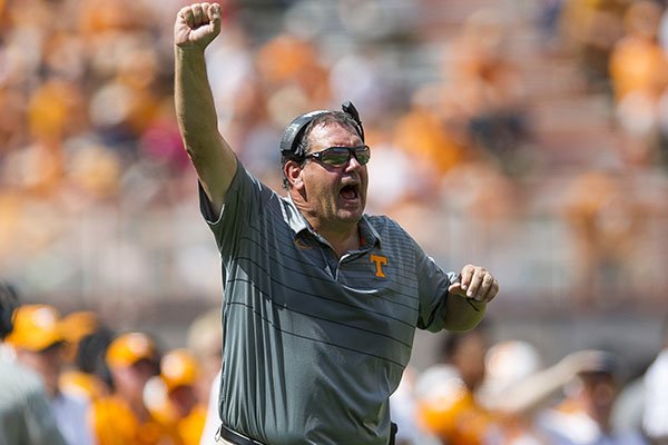 In this Sept. 23, 2017, file photo, Tennessee defensive line coach Brady Hoke yells from the sideline during an NCAA college football game against in Knoxville, Tenn. The firing of Tennessee head coach Butch Jones means that Hoke returns to the head coaching ranks, at least for a couple more weeks. (Clavin Mattheis/Knoxville News Sentinel via AP, File)

