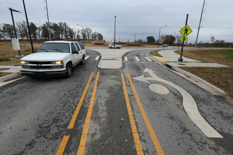 NWA Democrat-Gazette/J.T. WAMPLER A vehicle turns westbound from 56th St. onto Dearing Rd. in Springdale Tuesday Nov. 14, 2017.