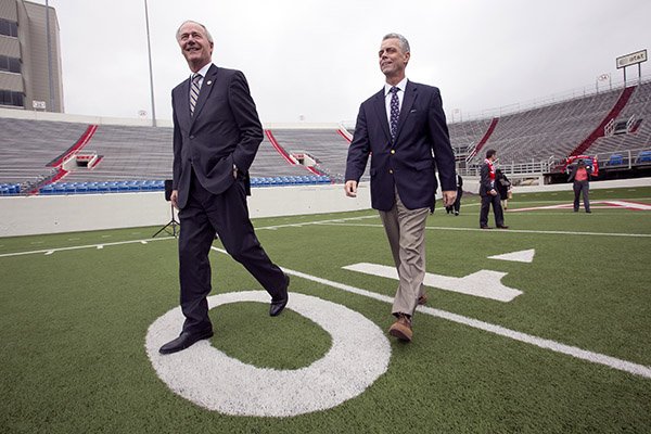 Arkansas Gov. Asa Hutchinson, left, and Kane Webb on Feb. 2, 2017, at War Memorial Stadium. (Photo by Benjamin Krain)
