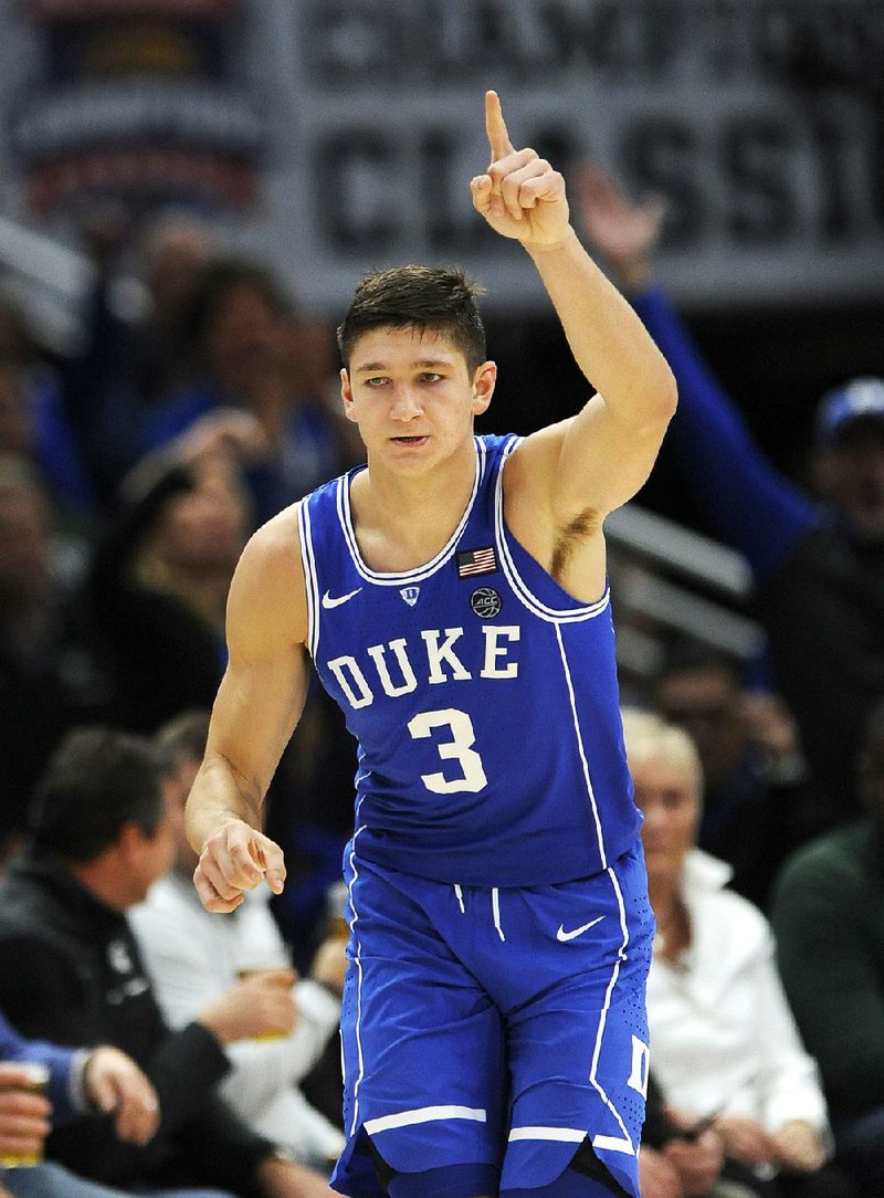 Grayson Allen scored a career-high 37 points to lead the No. 1 Duke Blue Devils, who used a 13-2 run late in the second half to earn an 88-81 victory over the No. 2 Michigan State Spartans in Chicago.