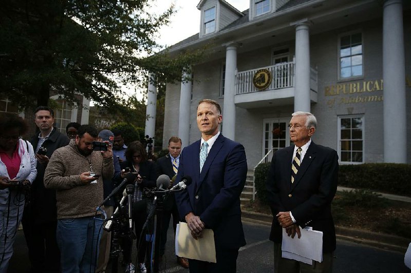 Phillip Jauregui, the attorney for U.S. Senate candidate Roy Moore, and Moore campaign chairman Bill Armistead (right) hold a news conference Wednesday in Birmingham, Ala. 
