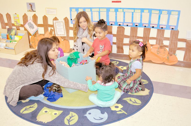 RACHEL DICKERSON/MCDONALD COUNTY PRESS Teachers and toddlers play at Early Head Start in Noel on Tuesday during an open house and ribbon-cutting ceremony.