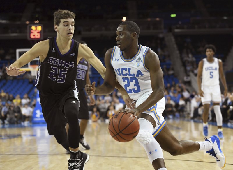 UCLA's Prince Ali (23) drives against Central Arkansas' Thatch Unruh (25) during the first half of an NCAA college basketball game in Los Angeles, Wednesday, Nov. 15, 2017. (AP Photo/Michael Owen Baker)
