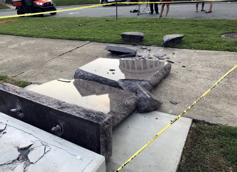 In this June 28 file photo, a Ten Commandments monument outside the state Capitol in Little Rock is blocked off after Michael Tate Reed crashed into it with a vehicle, less than 24 hours after the privately funded monument was installed on the Capitol grounds. A Pulaski County judge on Thursday found Reed unfit to proceed and ordered him to be held by the state hospital for further evaluation. Judge Chris Piazza set a September 2018 hearing on Reed's mental status. (AP Photo/Jill Zeman Bleed, File)