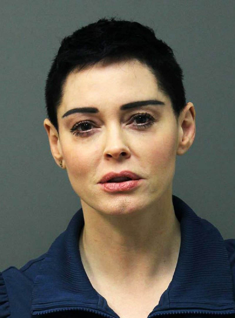 This image released Tuesday, Nov. 14, 2017 by the Loudoun County Sheriff's Office shows the booking photo for actress Rose McGowan who surrendered to Airports Authority Police on charges of possession of a controlled substance. 