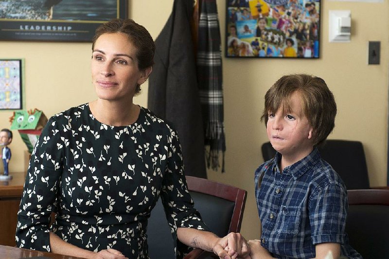 Isabel Pullman (Julia Roberts) is a stalwart advocate for her son Auggie (Jacob Tremblay) in the uplifting family drama Wonder.
