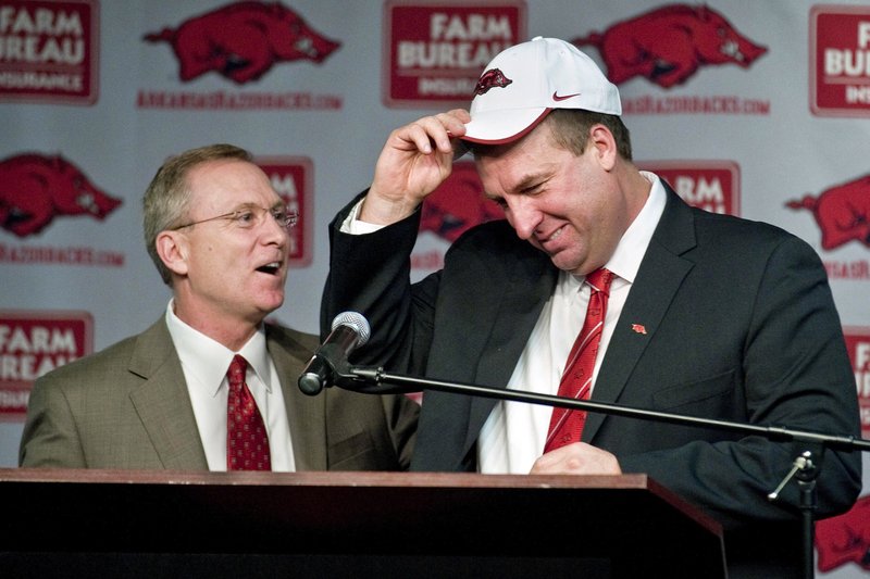 NWA Democrat-Gazette/Michael Woods UNCERTAIN FUTURE: Arkansas football coach Bret Bielema talks with Jeff Long during the first half of a football game against Alabama on Oct. 8, 2016, at Reynolds Razorback Stadium in Fayetteville. Following Long's dismissal as athletic director, Bielema's future with the Razorbacks remains in question.