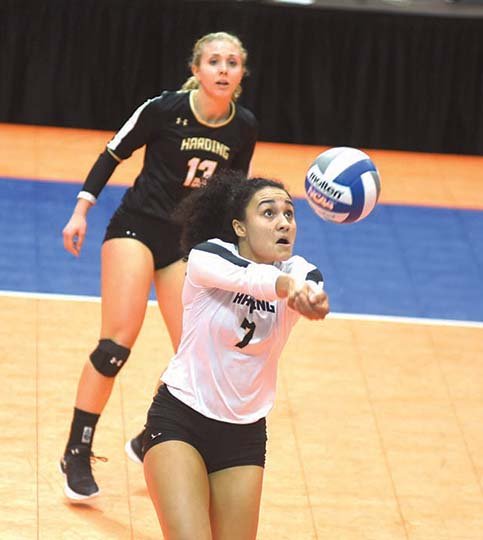 The Sentinel-Record/Mara Kuhn RETURN TO SENDER: Harding's Selena Foster (7) makes a return as Taylor Lake looks on during the first round of the Great American Conference volleyball tournament Thursday at Bank of the Ozarks Arena. The Lady Bison won 3-1, advancing to a semifinal matchup with Oklahoma Baptist at 3:30 p.m. today.