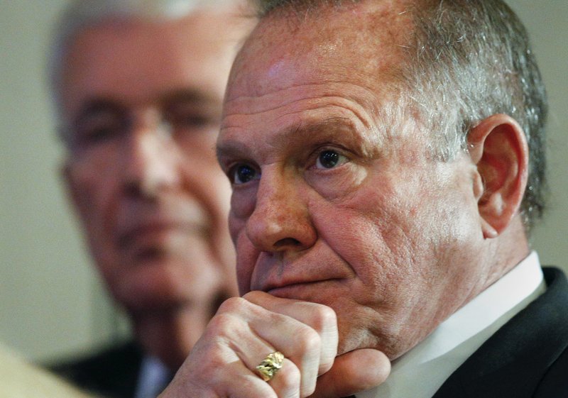 The Associated Press MOORE: Former Alabama Chief Justice and U.S. Senate candidate Roy Moore waits to speak at a newss conference Thursday in Birmingham, Ala.