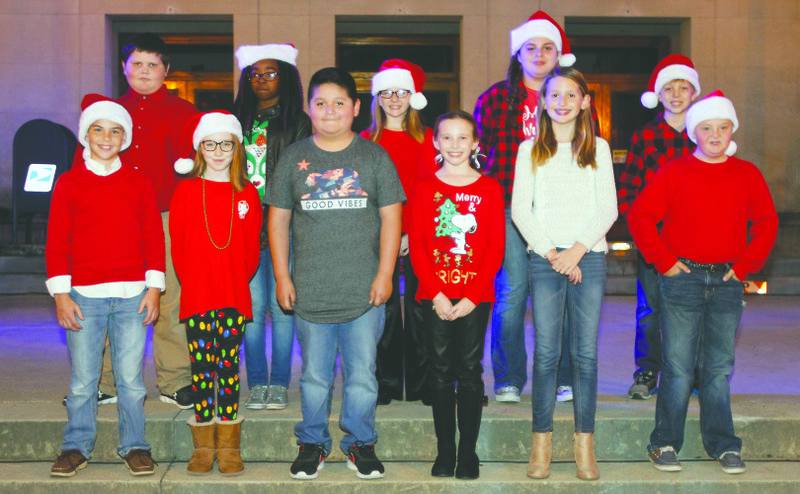 Marshals: The 2017 Grand marshals for the El Dorado Christmas parade pose for a photo at the downtown lighting ceremony Thursday.