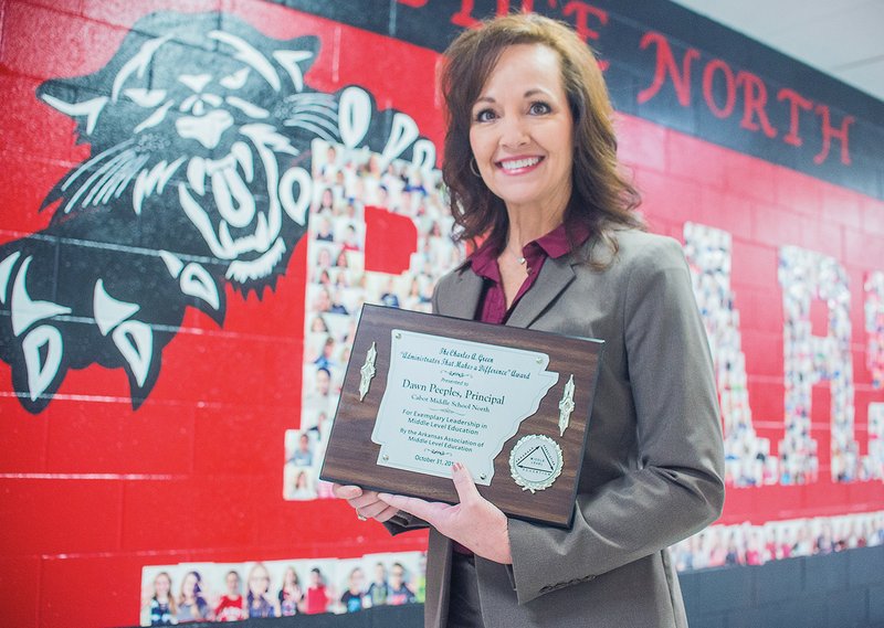 Dawn Peeples, principal of Cabot Middle School North, holds the plaque she received in October as the winner of the Charles A. Green Administrator That Makes a Difference award. It was presented by the Arkansas Association of Middle Level Professionals at its fall conference in Hot Springs. Green praised Peeples as “one of the best,” and said the school has all the ingredients to be successful under her leadership.