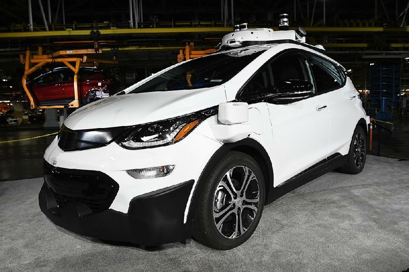 In this June photo, a self-driving Chevrolet Bolt EV that is in General Motors Co.’s autonomous vehicle development program appears on display at GM’s Orion Assembly in Lake Orion, Mich. 