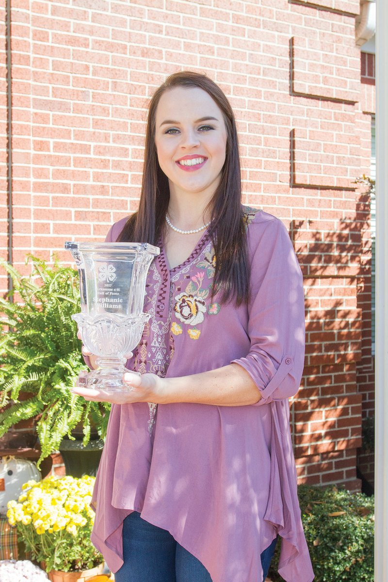Stephanie Williams of Searcy holds her award for being named to the Arkansas State 4-H Hall of Fame. Williams, a 2015 graduate of Harding Academy, received the award in June. She is the daughter of Bill and Ruth Williams.