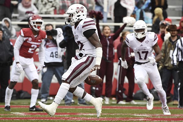 Mississippi State running back Aeris Williams slips through the Arkansas defense to score a touchdown during the first half of an NCAA college football game Saturday, Nov. 18, 2017 in Fayetteville. (AP Photo/Michael Woods)

