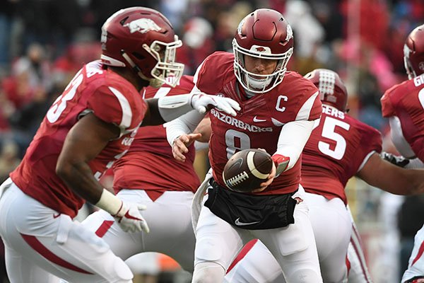 Arkansas quarterback Austin Allen fakes a handoff to running back David Williams during a game against Mississippi State on Saturday, Nov. 18, 2017, in Fayetteville. 