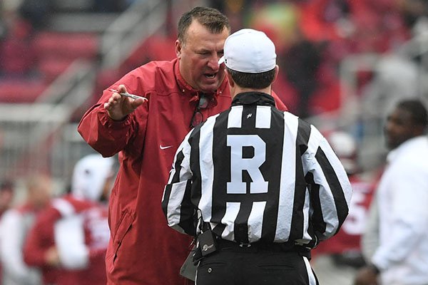Arkansas coach Bret Bielema argues with official Marc Curles during a game against Mississippi State on Nov. 18, 2017, in Fayetteville. 