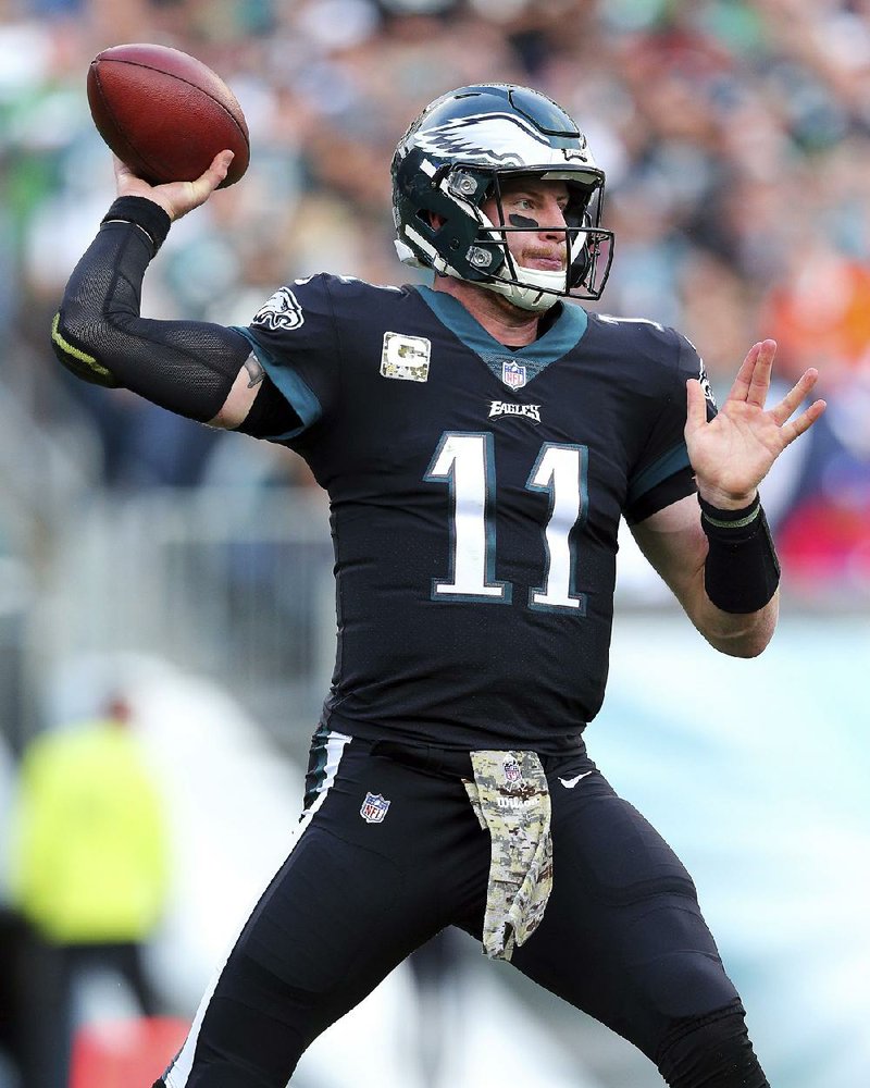 Eagles quarterback Carson Wentz (shown) leads his 9-1 squad into today’s showdown with Dak Prescott and the 5-4 Cowboys in a crucial battle between NFC East foes.