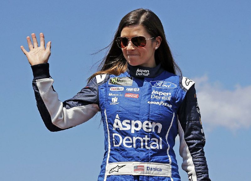 In this July 16, 2017, file photo, driver Danica Patrick waves prior to the NASCAR Cup Series auto race at the New Hampshire Motor Speedway in Loudon, N.H.