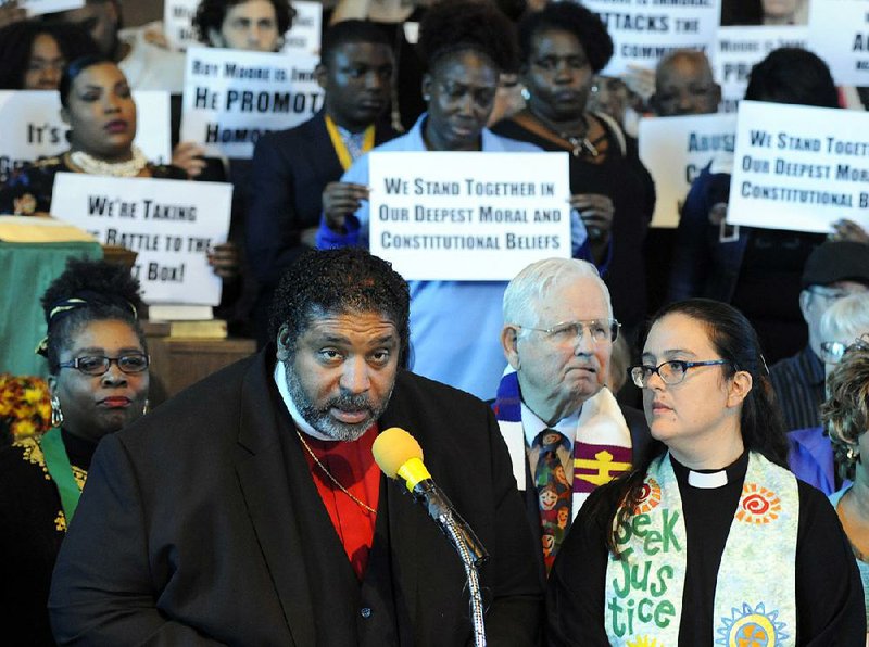 At a church in Birmingham, Ala., the Rev. William Barber speaks Saturday at a rally opposing Republican U.S. Senate candidate Roy Moore.