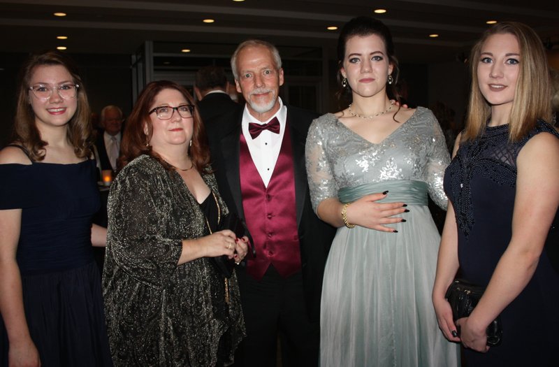 NWA Democrat-Gazette/CARIN SCHOPPMEYER Lily Bengston (from left), Randi and Chuck Bengston, Samantha Bengston and Grace Bengston attend Art of Hospice on Nov. 4 at Crystal Bridges in Bentonville. Chuck, Circle of Life chaplain, was presented the Pat Walker Commitment to Care Award at the benefit dinner.