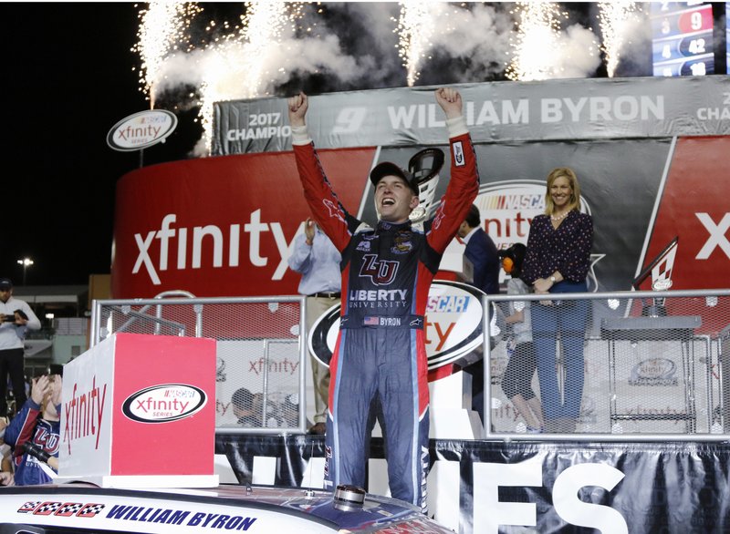 William Byron celebrates in Victory Lane after winning the NASCAR Xfinity Series auto racing season championship, Saturday, Nov. 18, 2017, at Homestead-Miami Speedway in Homestead, Fla.(AP Photo/Terry Renna)