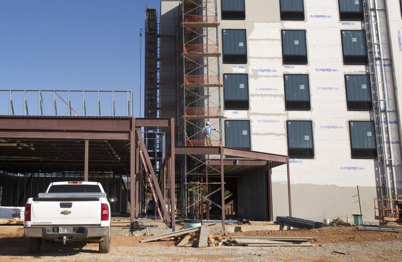 Construction continues Thursday at the Home2 Suites at 1519 S. 48th St. in Springdale. There has been an increase in weekend travelers, especially in Benton County, since Crystal Bridges Museum of American Art opened in November 2011, according to Tim Freeman, president of United Hotel Management.