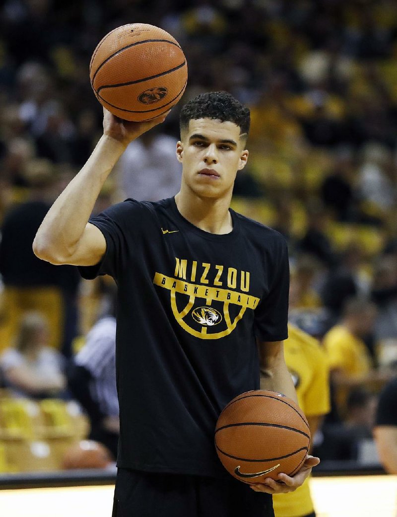  In this Nov. 10, 2017, file photo, Missouri's Michael Porter Jr. warms up before the start of an NCAA college basketball game against Iowa State, in Columbia, Mo. Michael Porter Jr. will miss the remainder of the season after undergoing lower back surgery, the school has announced.
