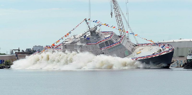 The USS Little Rock splashes into the Menominee River in Marinette, Wis., after its christening on July 18, 2015. The speedy vessel will be commissioned Dec. 16 in a ceremony in Buffalo, N.Y. 