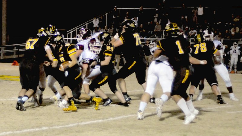 MARK HUMPHREY ENTERPRISE-LEADER/Prairie Grove senior fullback Aaron Preston (No. 8) runs behind solid blocking up-front. Preston's 36-yard gain on the Tigers' first play from scrimmage was instrumental in jump-starting a scoring drive after Stuttgart opened the game by scoring on their first possession to take a 6-0 lead. Prairie Grove won 24-14 with a pair of fourth quarter touchdowns and will face Warren on the road this week.