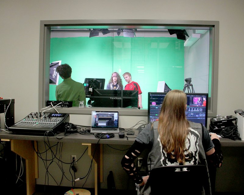LYNN KUTTER ENTERPRISE-LEADER Students are taught never to wear green in front of a green screen for taping but Asher Lee, a Farmington High senior, did not know he would be sitting in this spot on this day. Lee is involved in the school's broadcast journalism program.