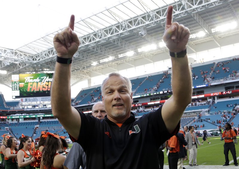 Miami head coach Mark Richt walks off the field after an NCAA college football game against Virginia, Saturday, Nov. 18, 2017, in Miami Gardens, Fla. Miami won 44-28. (AP Photo/Lynne Sladky)