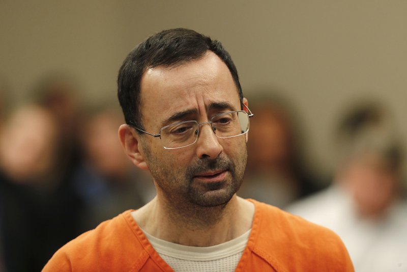 Dr. Larry Nassar, 54, appears in court for a plea hearing in Lansing, Mich., Wednesday, Nov. 22, 2017. Nasser, a sports doctor accused of molesting girls while working for USA Gymnastics and Michigan State University, pleaded guilty to multiple charges of sexual assault and will face at least 25 years in prison. (AP Photo/Paul Sancya)

