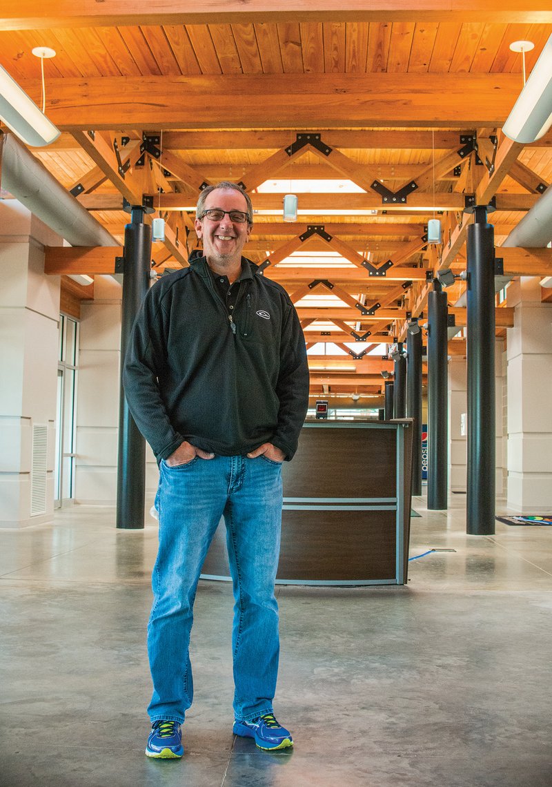 Jeff Owens, parks director for the city of Batesville, stands in the hallway leading to the indoor aquatics space of the Batesville Community Center and Aquatics Park. Owens and other city officials recently accepted the 2017 Facility of the Year award from the Arkansas Recreation and Parks Association. Owens is a past president and board member of the statewide association.