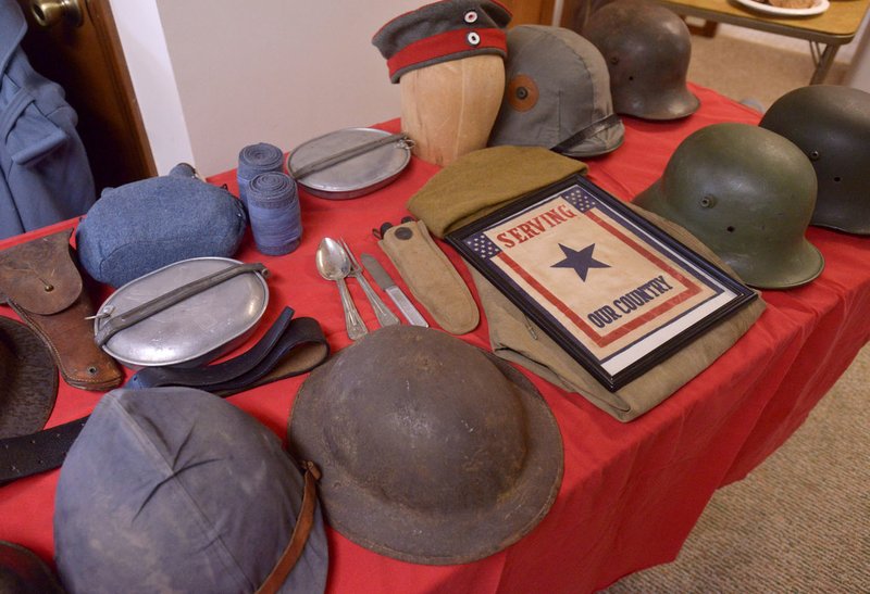 NWA Democrat-Gazette/BEN GOFF @NWABENGOFF World War I artifacts from the collection of Carlos Valdez of Bella Vista sit on display during the annual meeting of the Bella Vista Historical Society in March at the Bella Vista Historical Museum. The program was held in advance of the 100th anniversary of the U.S. Congress declaring of war against the German Empire in April 1917.