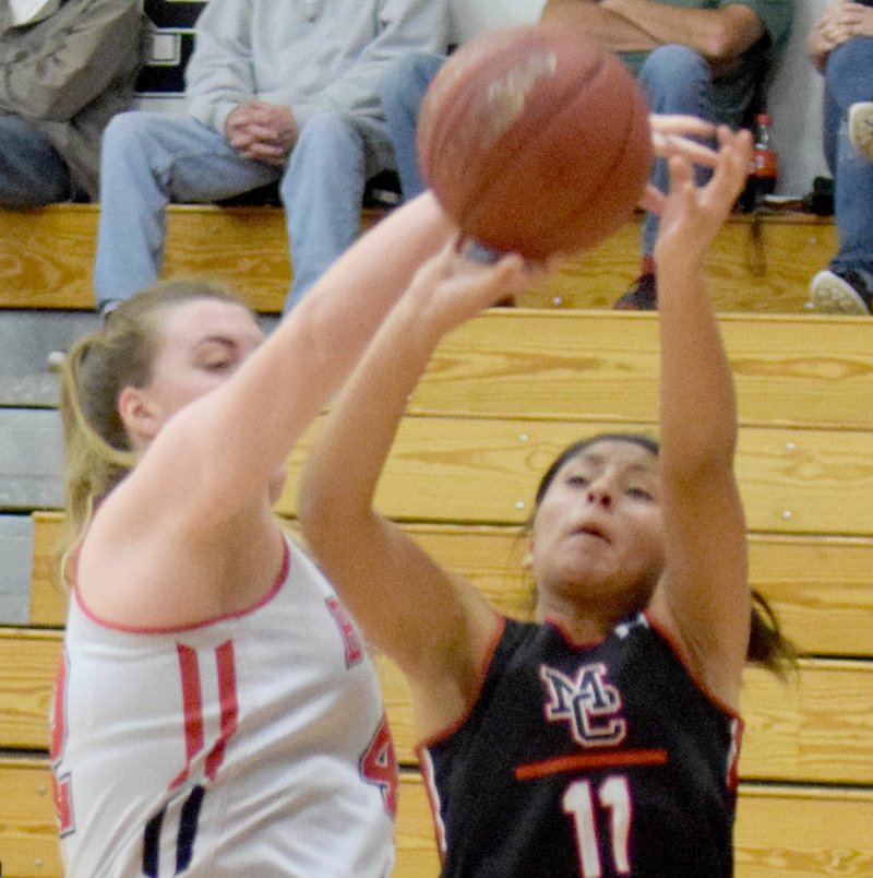 RICK PECK SPECIAL TO MCDONALD COUNTY PRESS McDonald County's Rita Santillan gets fouled while taking a shot against Carl Junction at a scrimmage held Nov. 16 at Carl Junction High School.