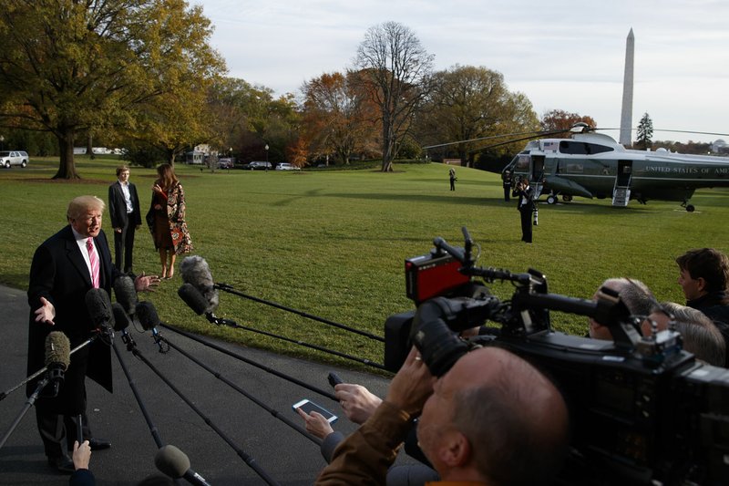 AP/EVAN VUCCI President Donald Trump speaks Tuesday to reporters before leaving the White House for a Thanksgiving trip to Palm Beach, Fla. Trump all but endorsed embattled Alabama Republican Senate nominee Roy Moore, discounting the sexual assault allegations against him and repeatedly insisting voters must not support Moore's rival.