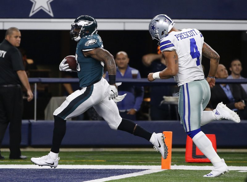 Philadelphia Eagles' Nigel Bradham (53) scores a touchdown after recovering a Dallas Cowboys' Dak Prescott (4) fumble in the second half of an NFL football game, Sunday, Nov. 19, 2017, in Arlington, Texas. (AP Photo/Ron Jenkins)