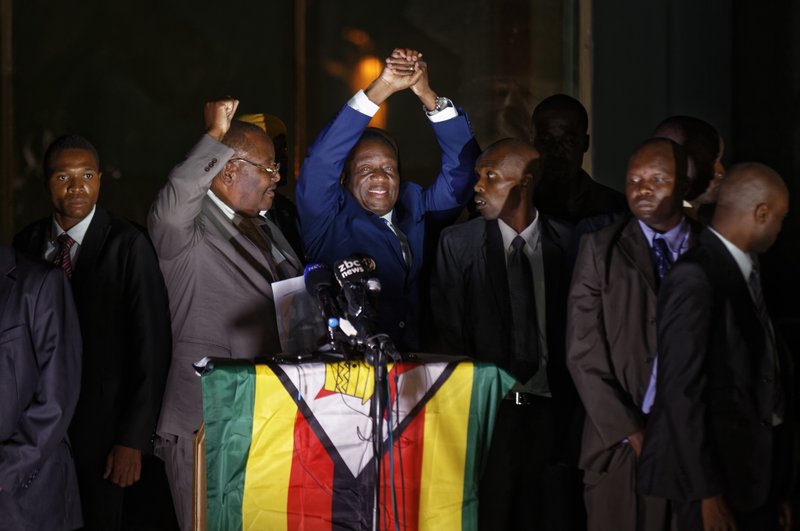 Zimbabwe's President in waiting Emmerson Mnangagwa, greets supporters gathered outside the Zanu-PF party headquarters in Harare, Zimbabwe Wednesday, Nov. 22, 2017. (AP Photo/Ben Curtis)